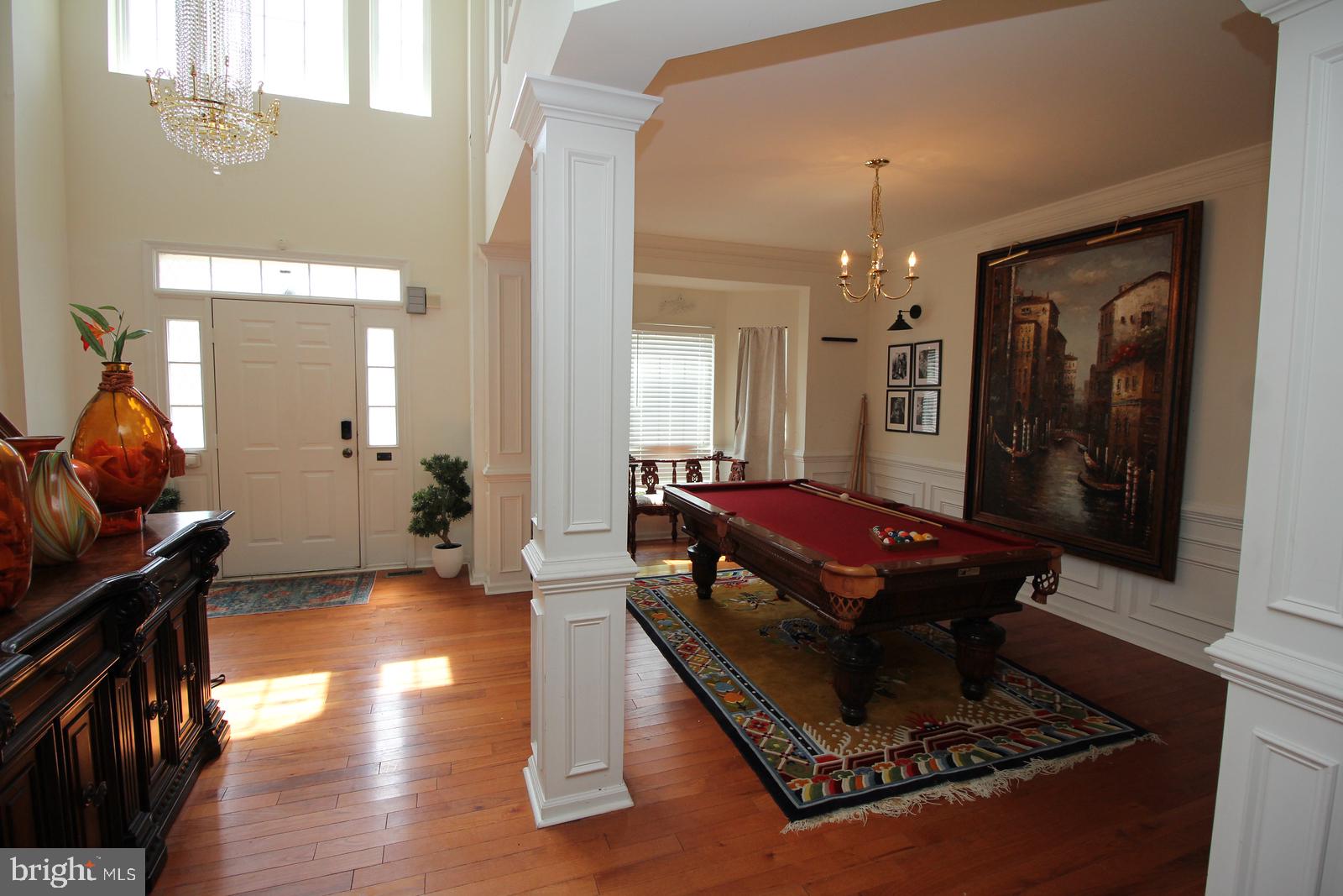 5 Kelly Drive Sicklerville, NJ 08081 - Photo 8 of 32 a living room with a piano table and a chandelier