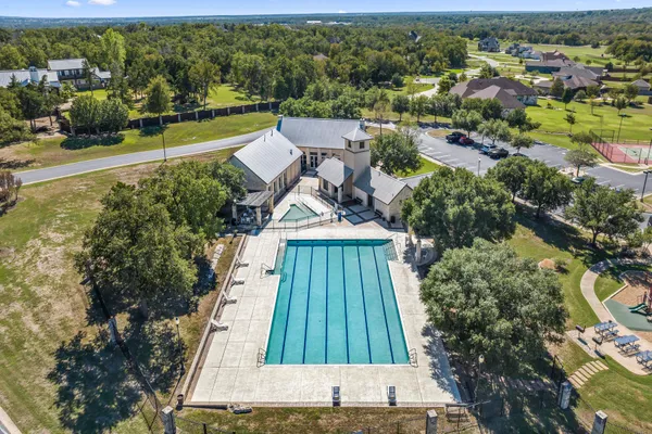 an aerial view of a house with outdoor space