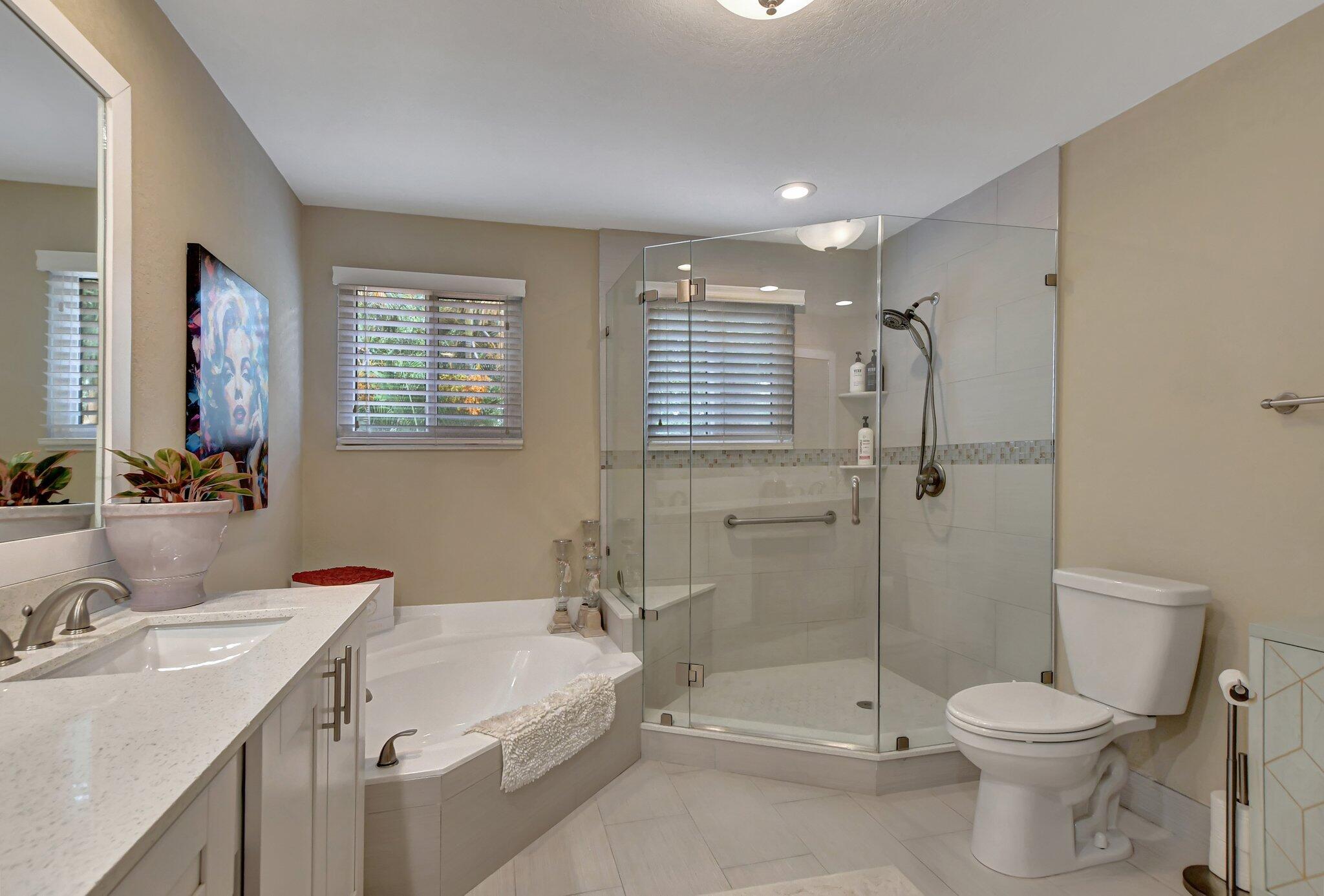 6682 Via Regina Boca Raton, FL 33433 - Photo 14 of 46 a bathroom with a sink toilet and shower