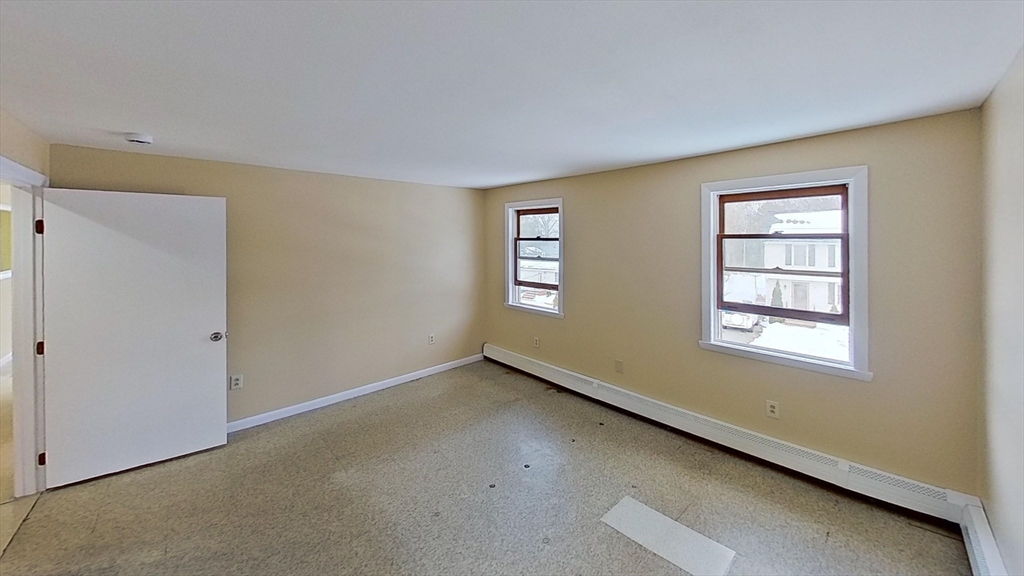 52 Rockefeller Street, Unit 2 Randolph, MA 02368 - Photo 9 of 9 a view of an empty room with a window