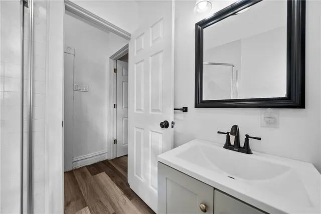 a bathroom with a sink and a mirror
