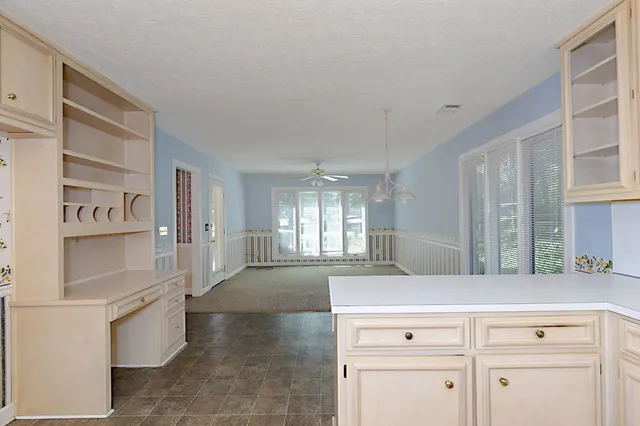 a view of a kitchen cabinets and windows