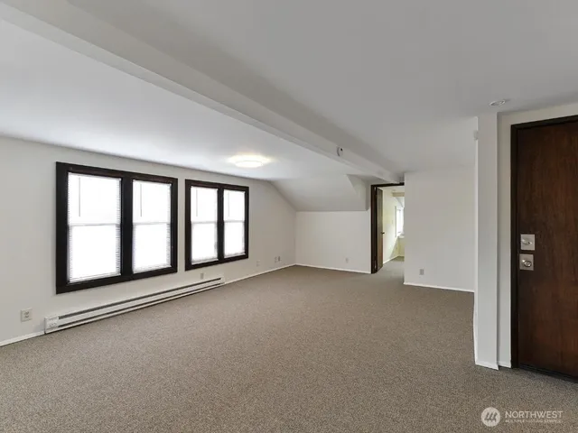 a view of an empty room with a window