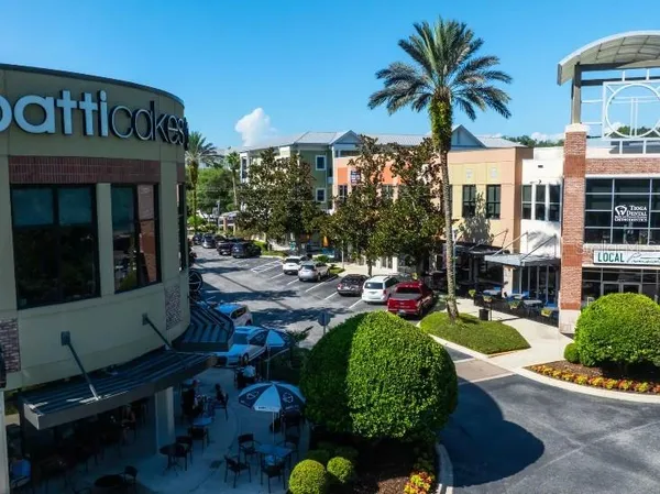 a view of a chairs and table in a patio