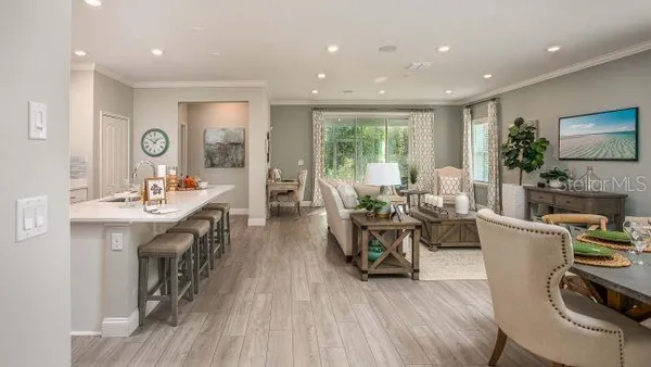 a living room with furniture a fireplace and a table