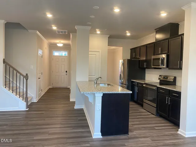 a large kitchen with stainless steel appliances