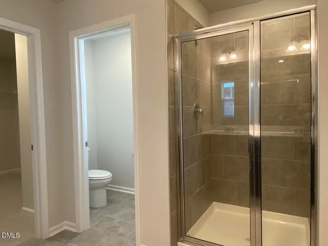 a bathroom with a double vanity sink a and a mirror