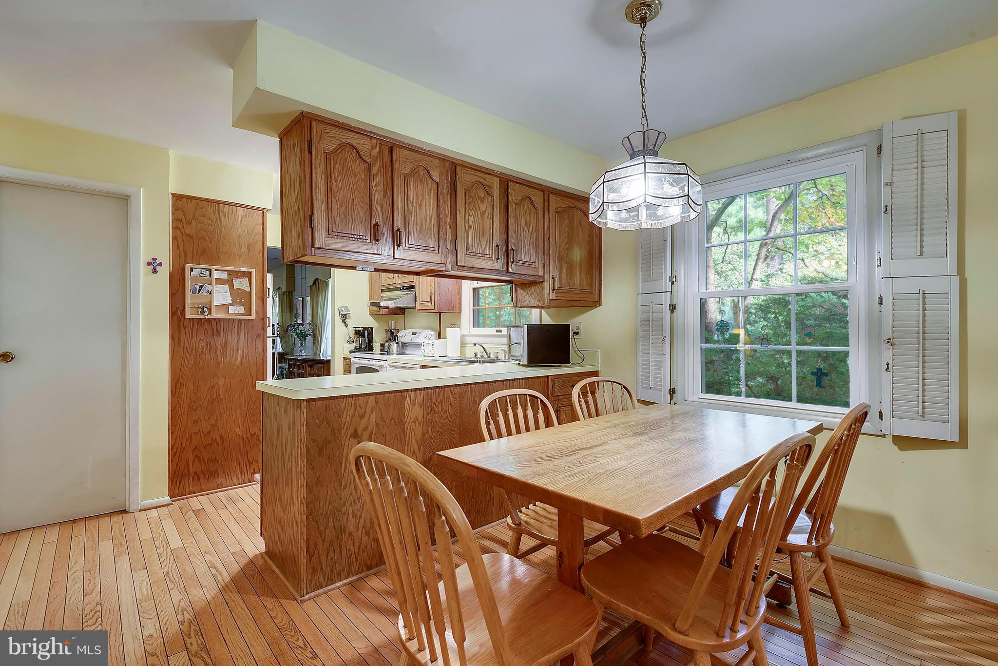 11003 Howland Drive Reston, VA 20191 - Photo 5 of 21 a view of a dining room with furniture window and wooden floor