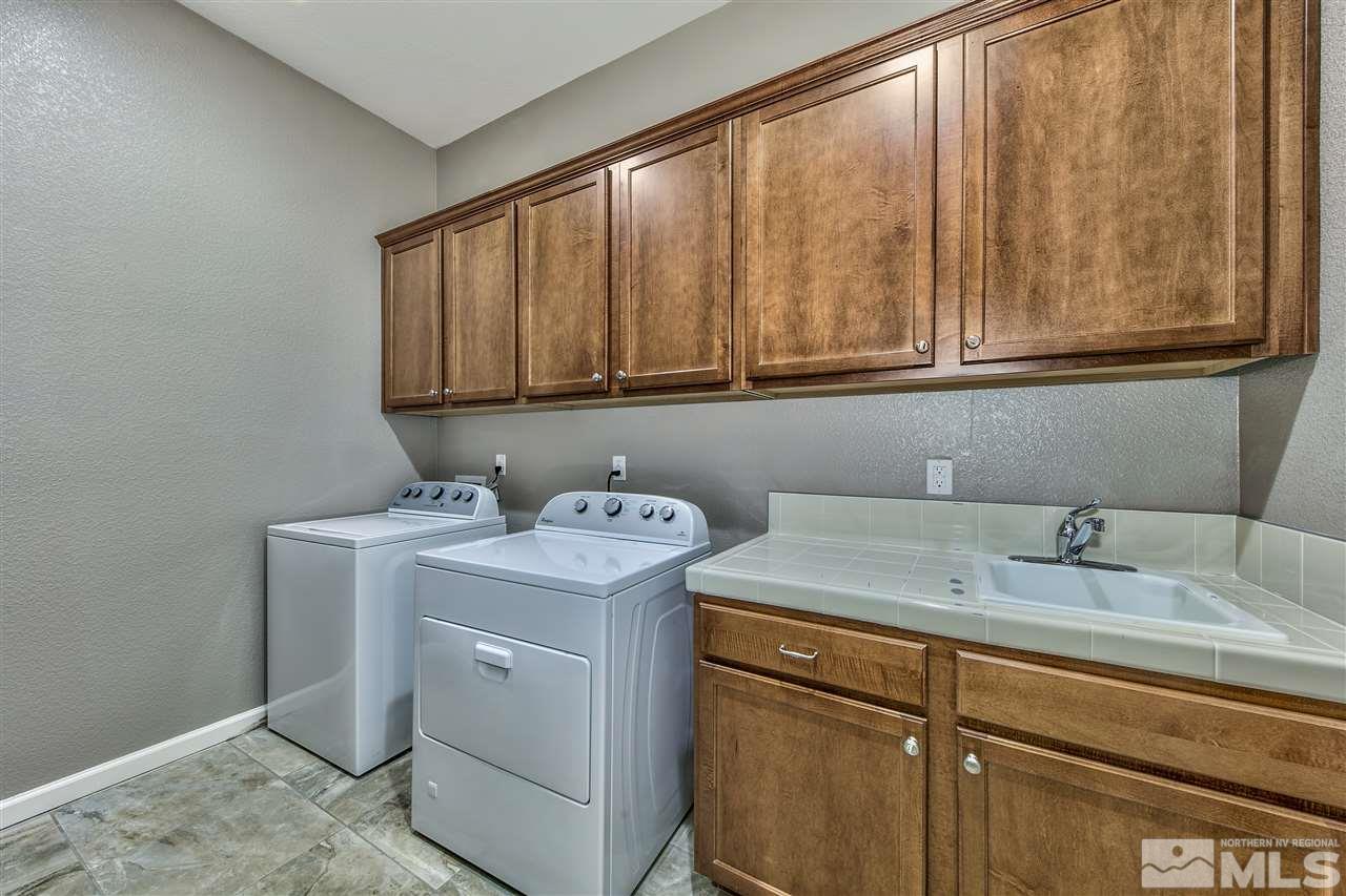 2109 Gregorgio Ln. Reno, NV 89521 - Photo 17 of 38 a utility room with dryer and washer