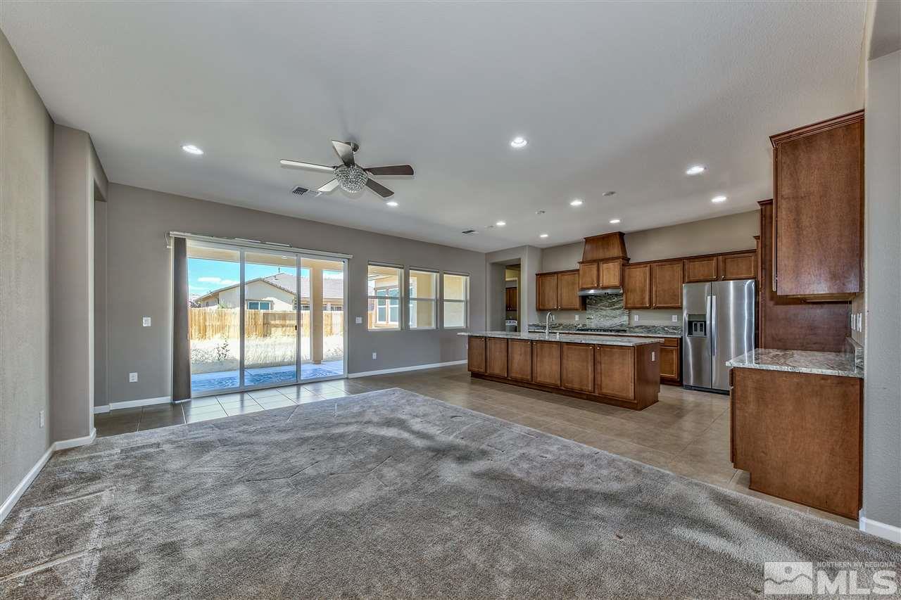 2109 Gregorgio Ln. Reno, NV 89521 - Photo 3 of 38 a view of an empty room with kitchen and window