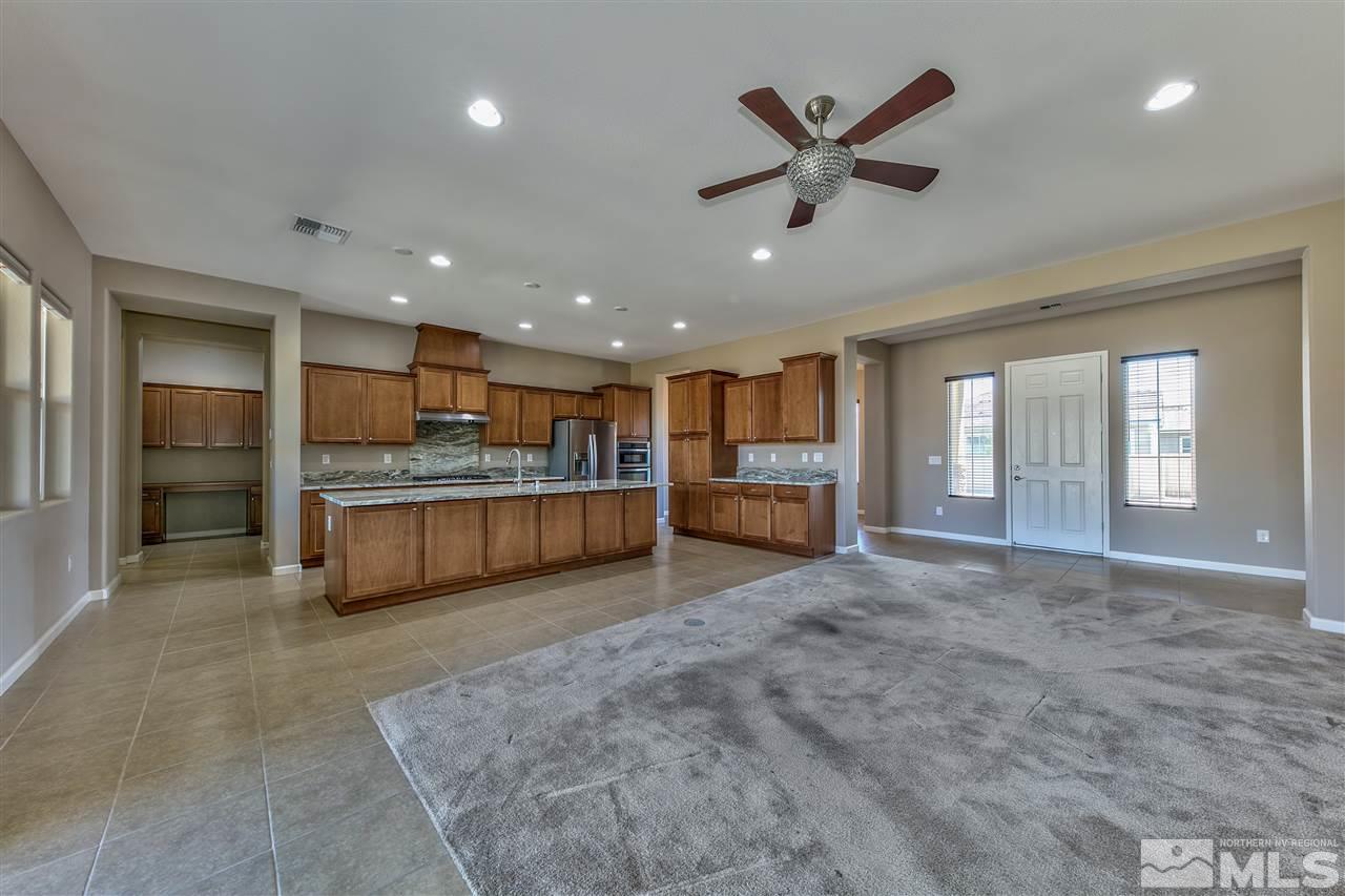 2109 Gregorgio Ln. Reno, NV 89521 - Photo 8 of 38 a view of kitchen with refrigerator and windows
