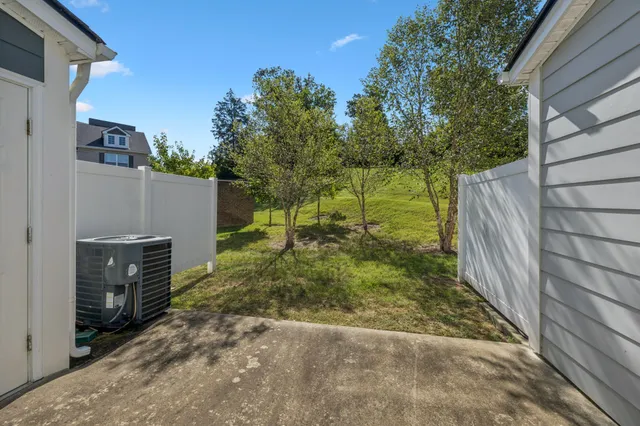 a backyard of a house with lots of green space