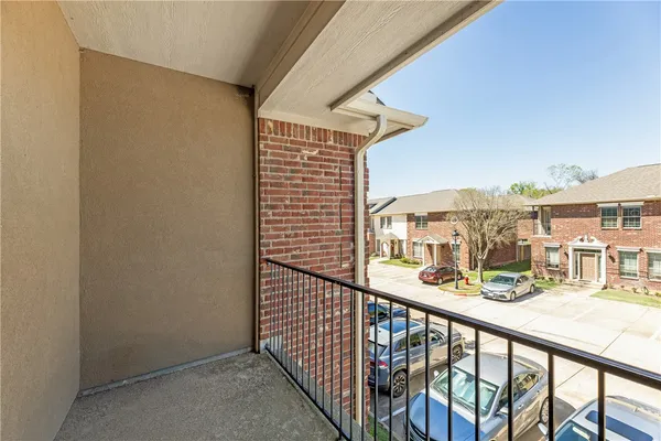 a view of balcony with furniture