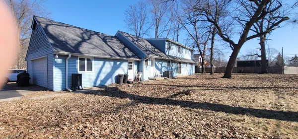 a view of a house with a snow in the yard
