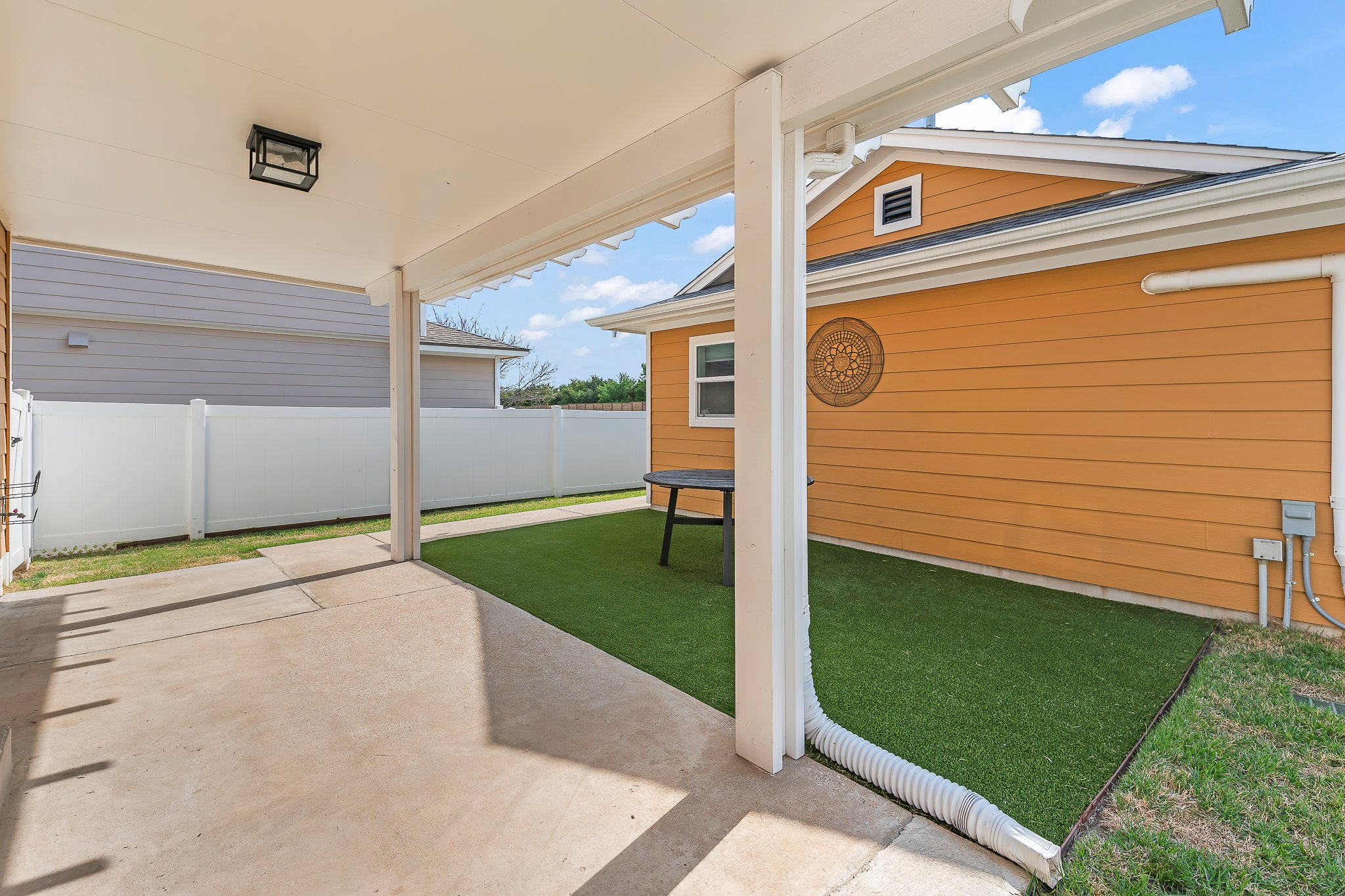 1413 Davis Mountain Loop Cedar Park, TX 78613 - Photo 24 of 31 The covered Patio spae leads to a detached 2 car Garage . This one is special as it was used as a personal training gym & is Air Conditioned!!
