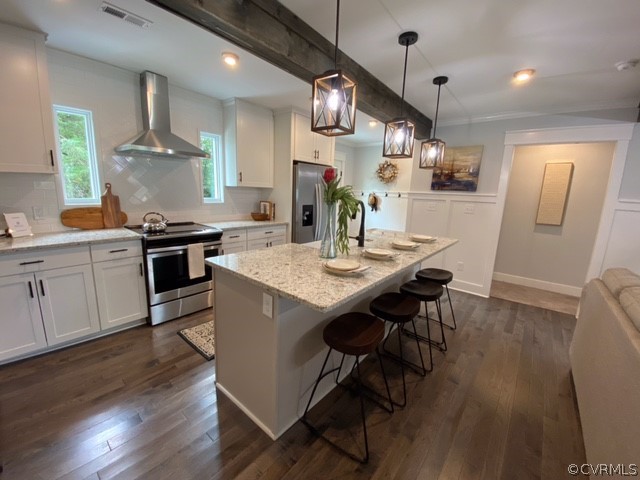 1793 Maidens Road Maidens, VA 23102 - Photo 2 of 40 a kitchen with stainless steel appliances granite countertop a stove a sink dishwasher a dining table and chairs with wooden floor