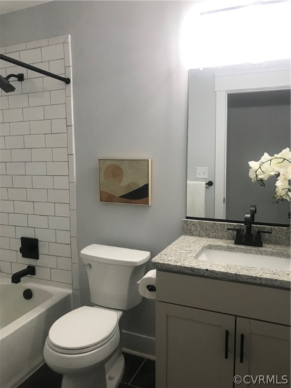 1793 Maidens Road Maidens, VA 23102 - Photo 29 of 40 a bathroom with a granite countertop toilet sink and mirror