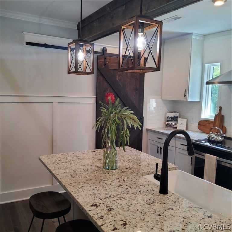 1793 Maidens Road Maidens, VA 23102 - Photo 4 of 40 a view of a kitchen with kitchen island a sink and wooden floor