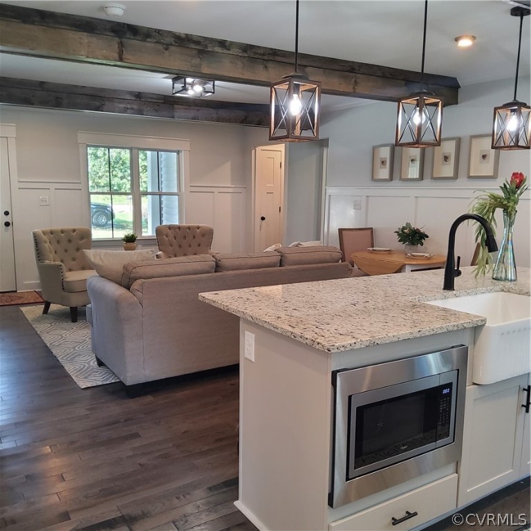 1793 Maidens Road Maidens, VA 23102 - Photo 5 of 40 a kitchen with stainless steel appliances granite countertop a sink a microwave a stove and a wooden floors