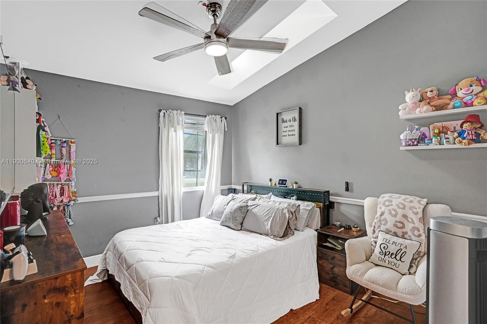 12221 Southwest 144th Terrace Miami, FL 33186 - Photo 17 of 42 a bedroom with furniture and a chair