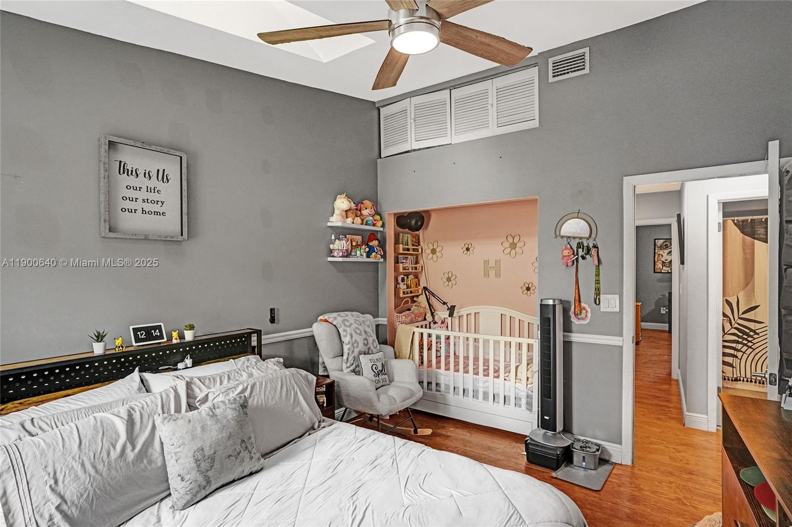 12221 Southwest 144th Terrace Miami, FL 33186 - Photo 20 of 42 a bedroom with furniture and wooden floor
