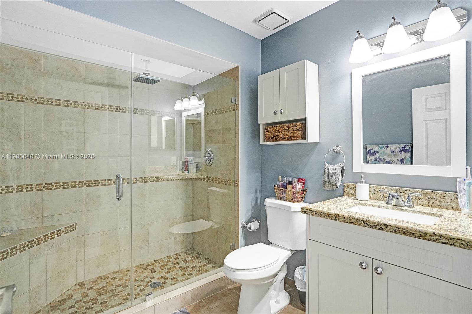 12221 Southwest 144th Terrace Miami, FL 33186 - Photo 30 of 42 a bathroom with a sink toilet and shower