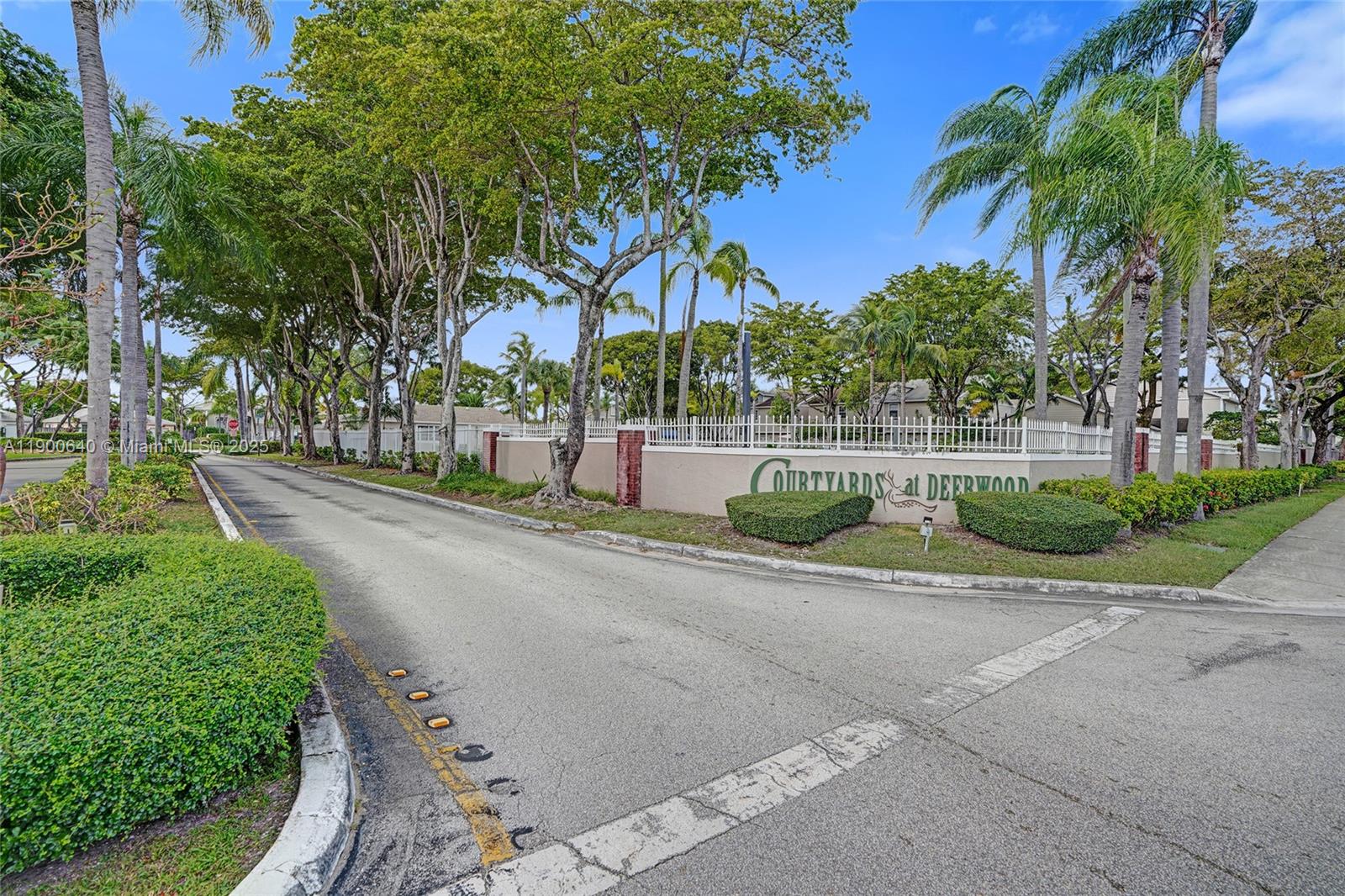 12221 Southwest 144th Terrace Miami, FL 33186 - Photo 40 of 42 a view of a house with a yard and coconut trees