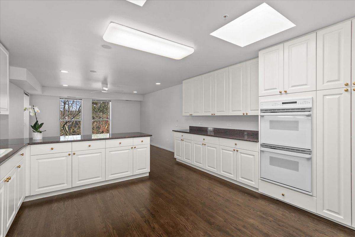 380 Green Bay Road, Unit 4D Winnetka, IL 60093 - Photo 13 of 25 a kitchen with appliances cabinets and a sink