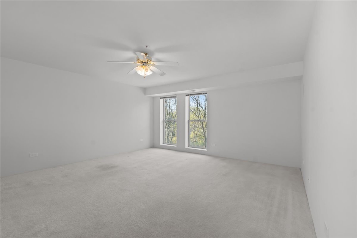 380 Green Bay Road, Unit 4D Winnetka, IL 60093 - Photo 17 of 25 wooden floor in an empty room with a window