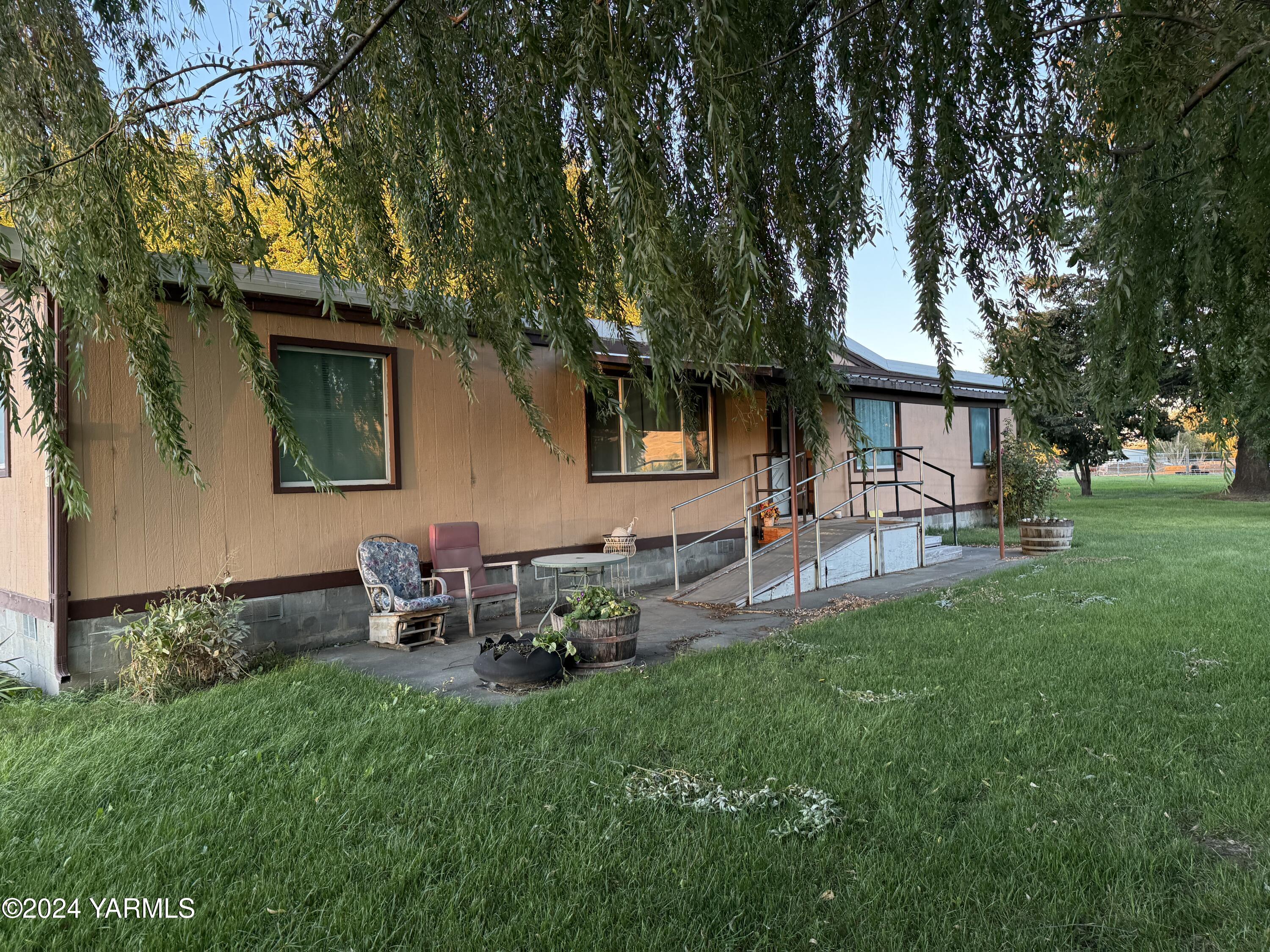 19101 North Beers Road Prosser, WA 99350 - Photo 12 of 45 a view of backyard of house with outdoor seating and green space