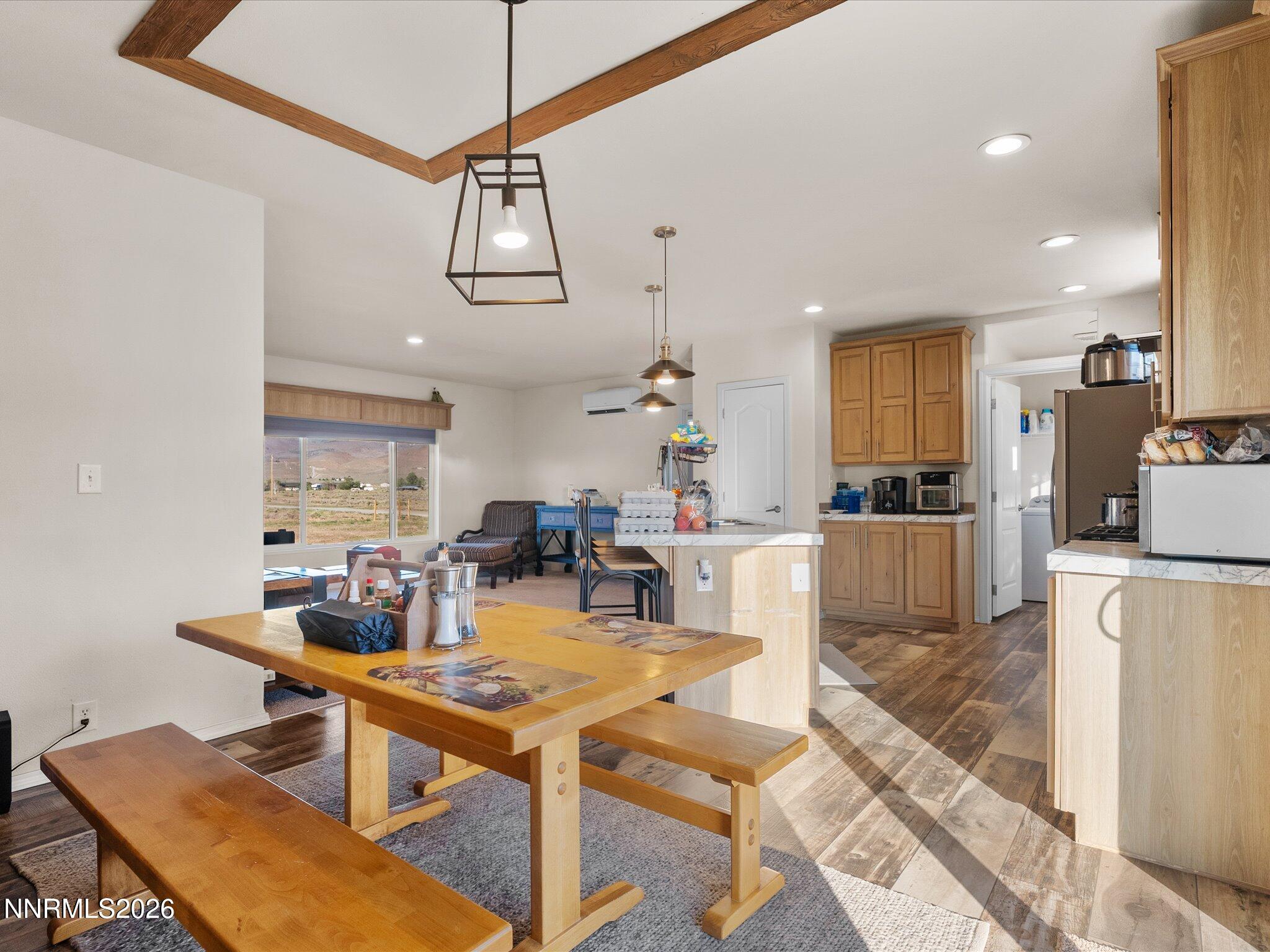 4555 Amy Road Reno, NV 89510 - Photo 16 of 74 a view of a dining room and livingroom with furniture wooden floor a chandelier