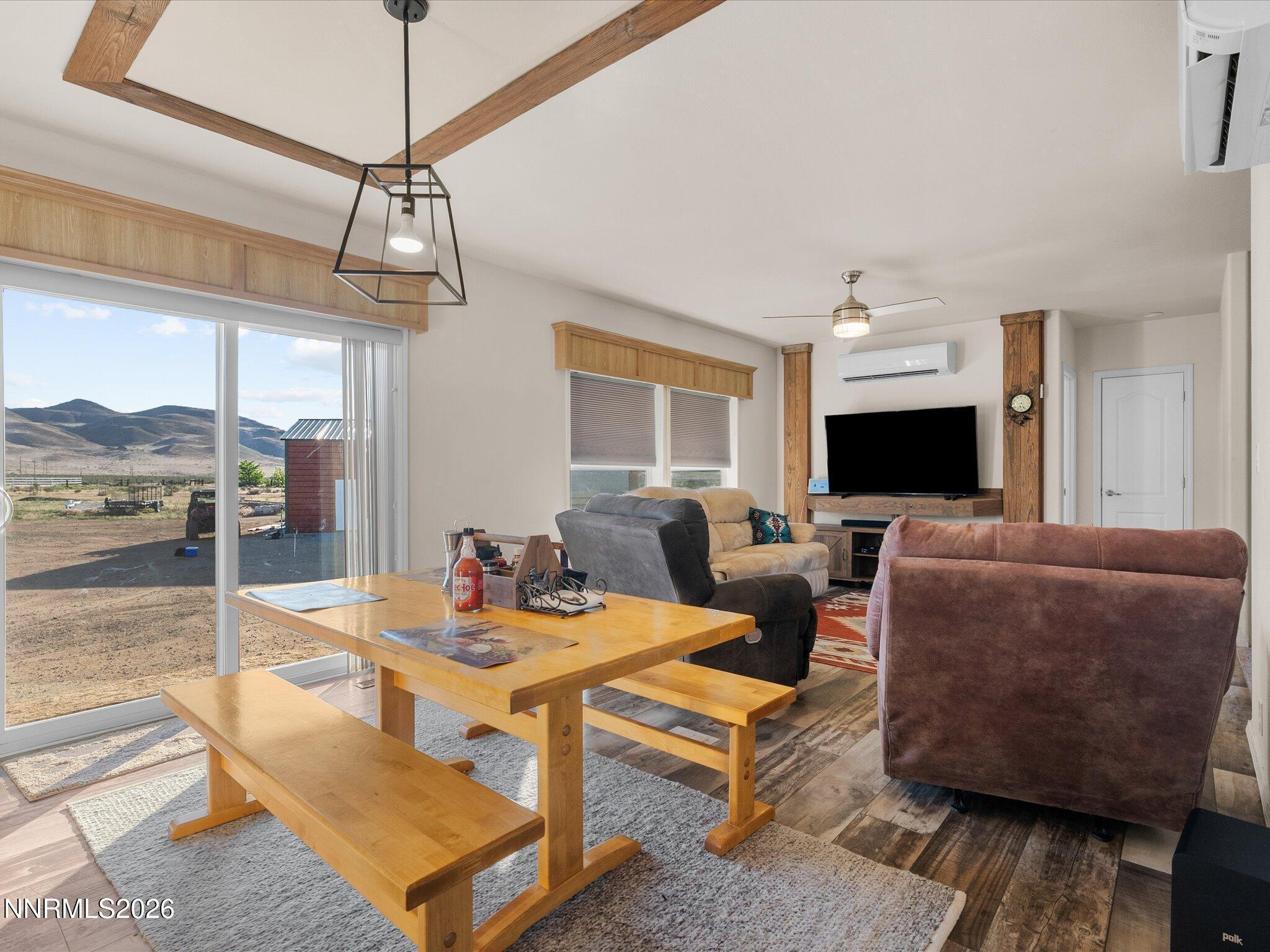4555 Amy Road Reno, NV 89510 - Photo 17 of 74 a living room with furniture a chandelier and a flat screen tv