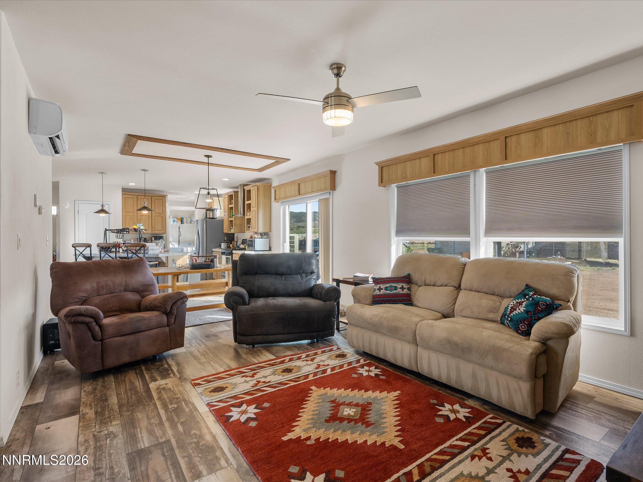 4555 Amy Road Reno, NV 89510 - Photo 19 of 74 a living room with furniture ceiling fan and a rug
