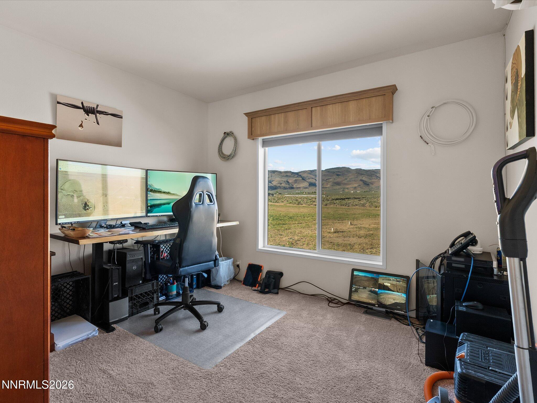 4555 Amy Road Reno, NV 89510 - Photo 22 of 74 a view of a workspace with furniture and a window