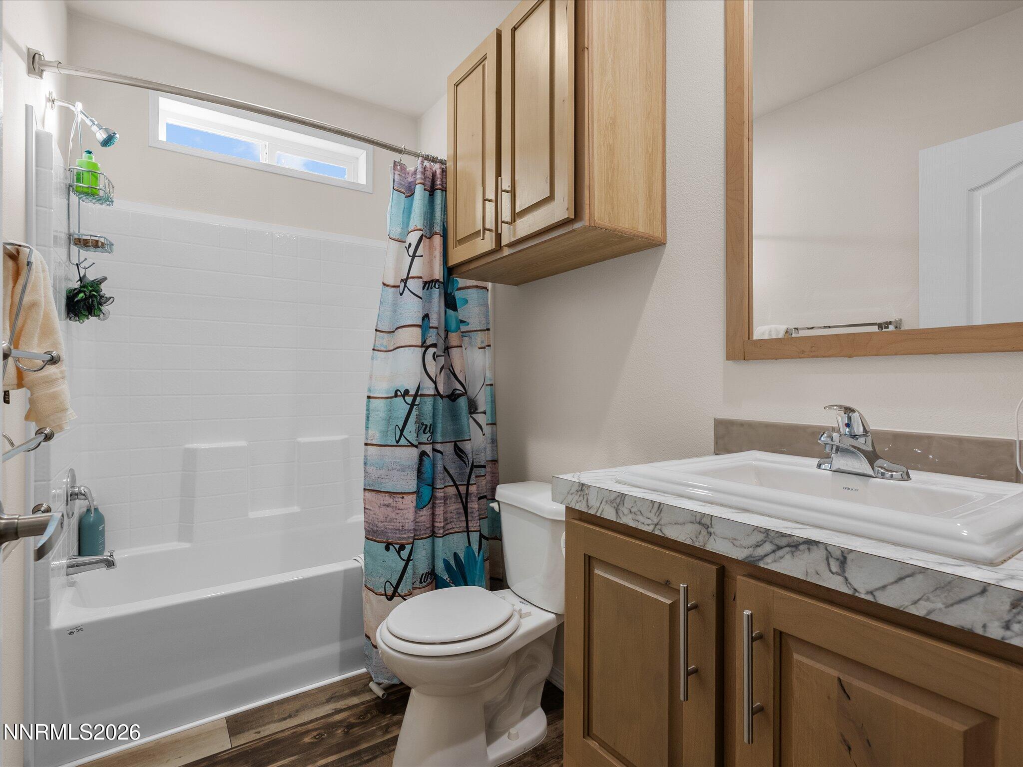 4555 Amy Road Reno, NV 89510 - Photo 23 of 74 a bathroom with a sink a toilet and bathtub