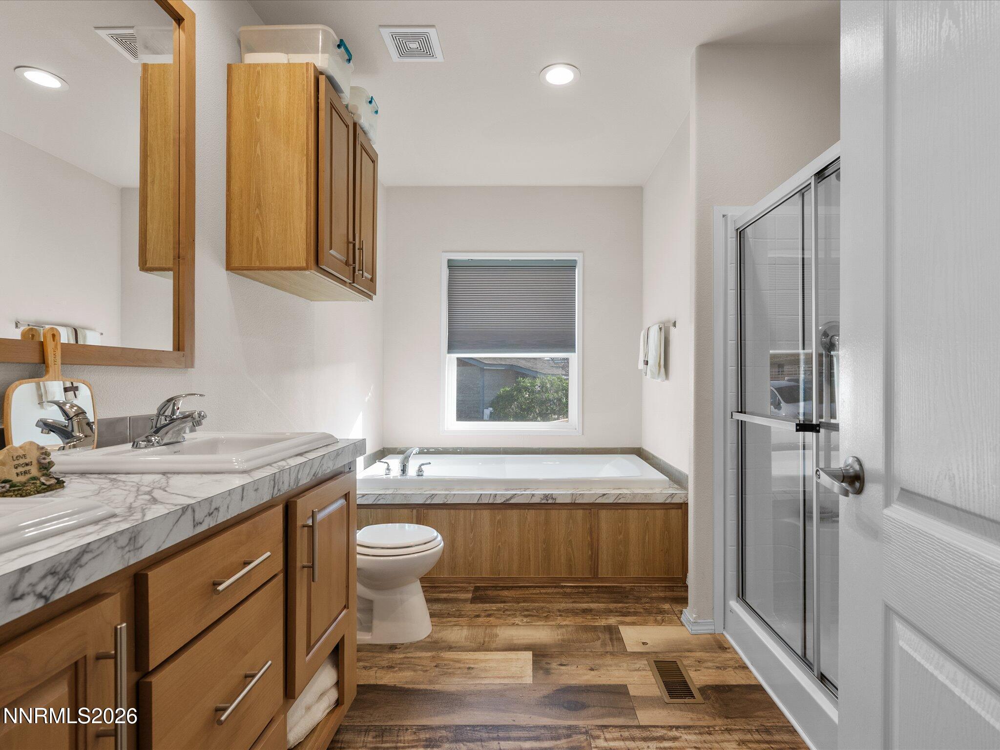 4555 Amy Road Reno, NV 89510 - Photo 29 of 74 a bathroom with a granite countertop sink toilet and shower