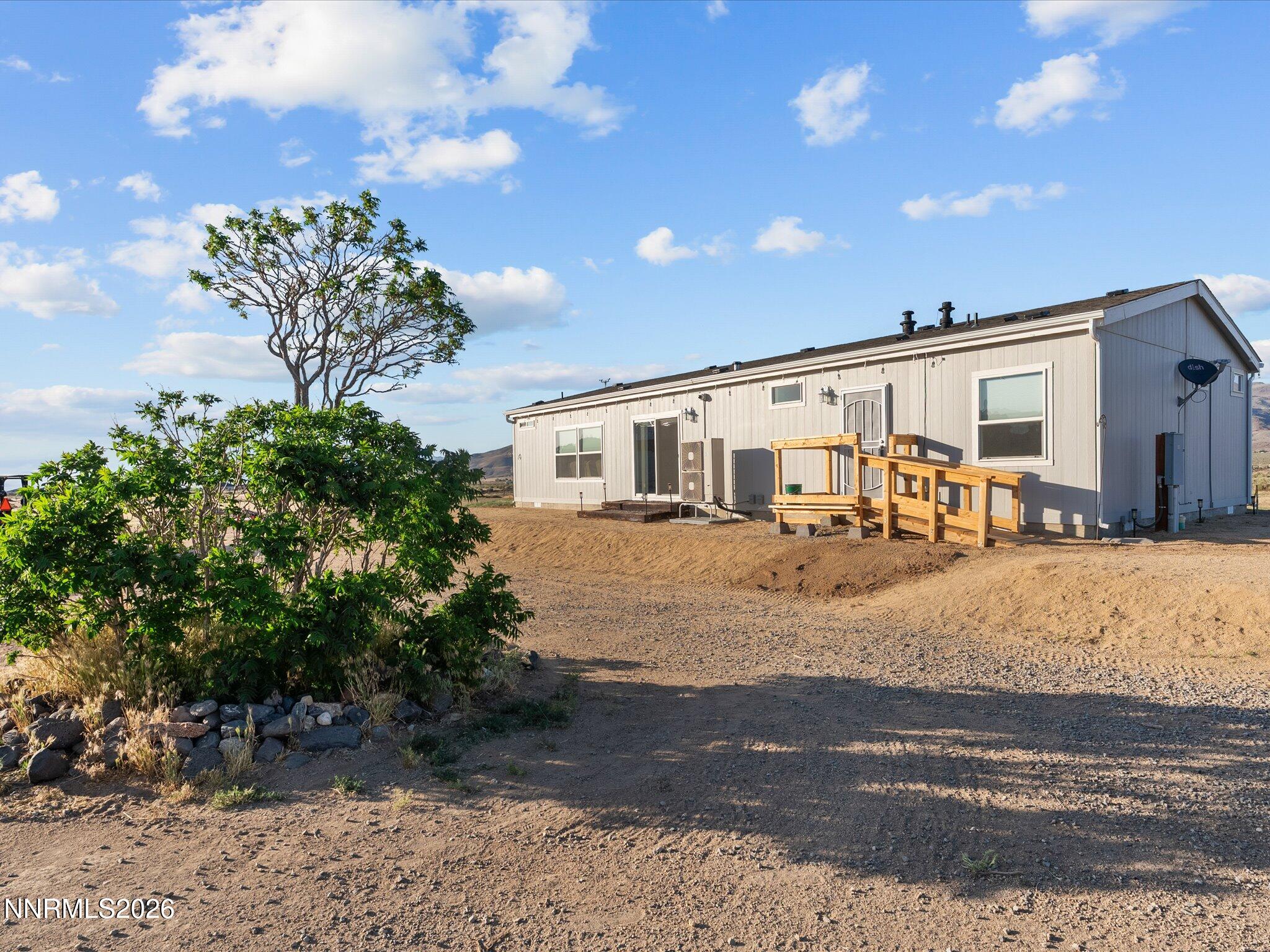 4555 Amy Road Reno, NV 89510 - Photo 6 of 74 a front view of a house with a yard