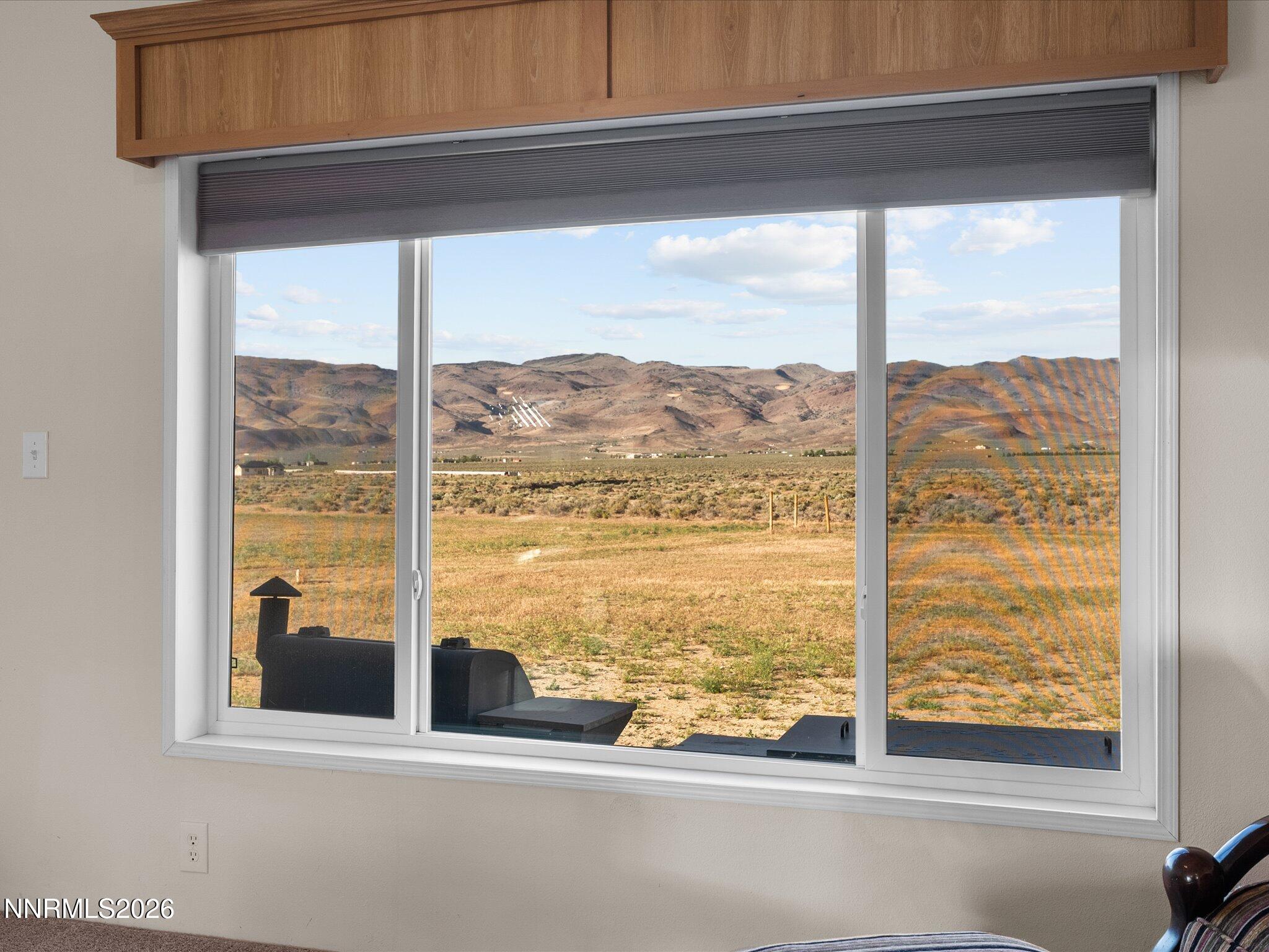 4555 Amy Road Reno, NV 89510 - Photo 10 of 74 a view of a room with a large window and a bed