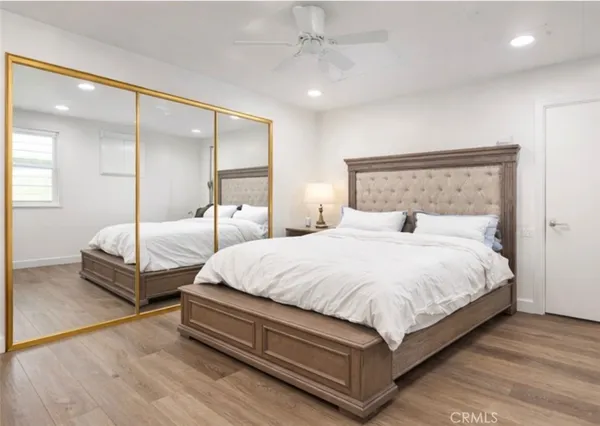 a bedroom with two beds and white walls