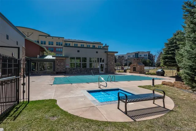 a view of a patio with a table and chairs