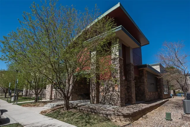 a front view of a house with trees