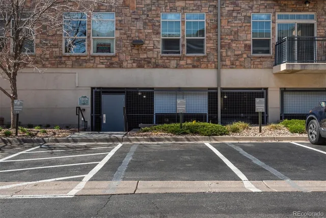 a view of a brick building next to a yard