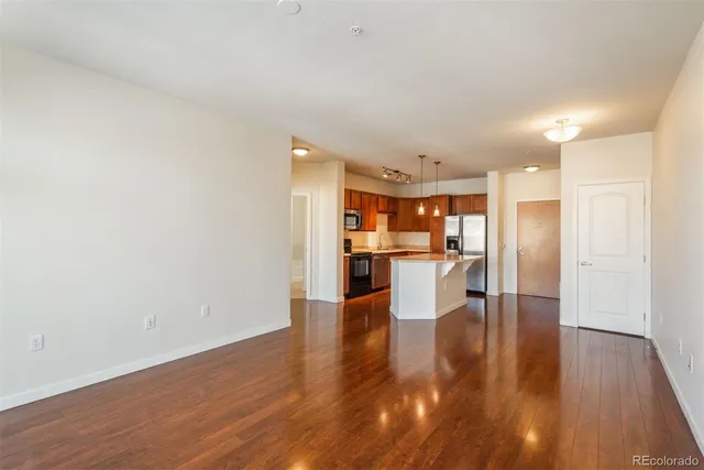 a view of kitchen dining table chairs microwave and cabinets