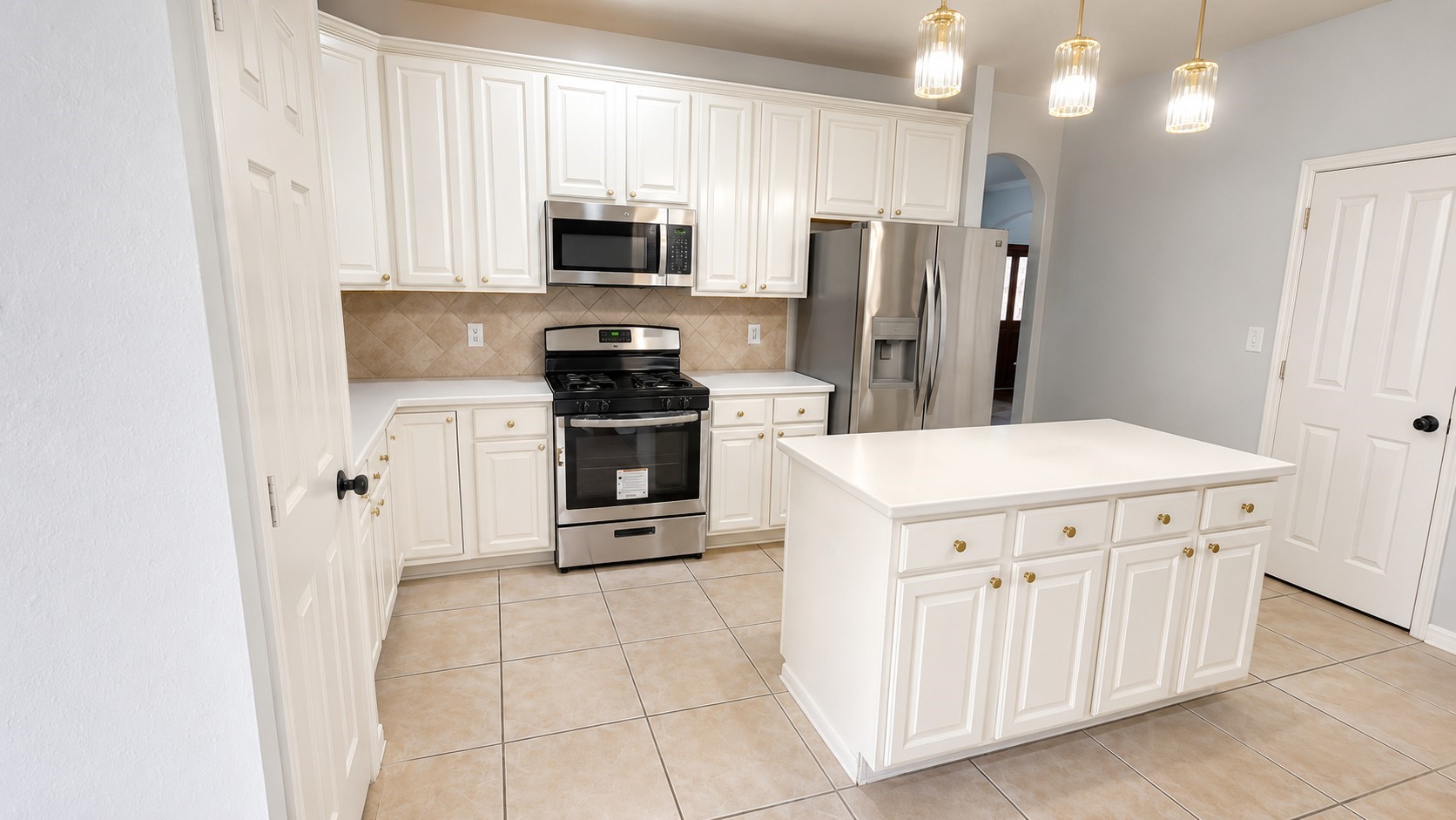 20203 Timberstone Lane Spring, TX 77379 - Photo 8 of 23 The island kitchen is both functional and welcoming, featuring gas cooking, ample counter space, and room to gather. It opens to the main living area, making it ideal for entertaining.