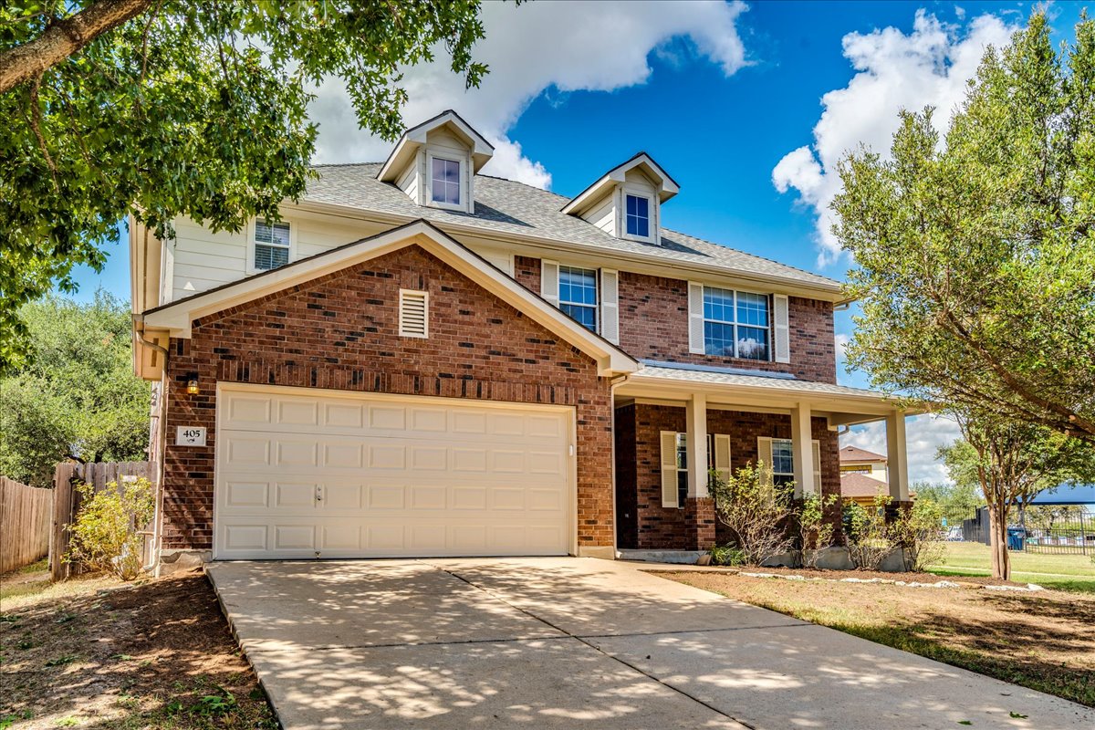 405 Olmos Drive Leander, TX 78641 - Photo 1 of 1 a front view of a house with a yard