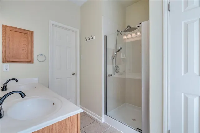 a bathroom with a tub sink and shower