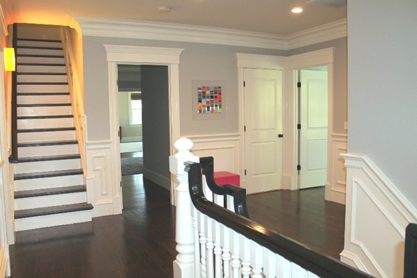 21 Parker Street Lexington, MA 02421 - Photo 16 of 30 a view of a hallway with wooden floor and windows