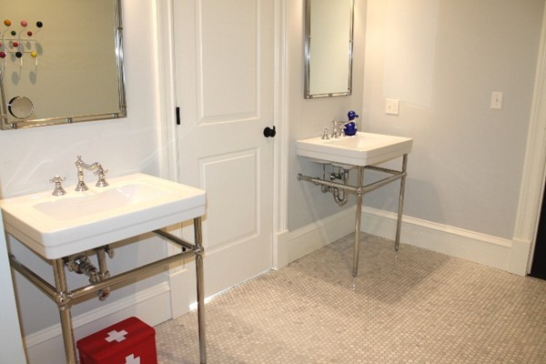 21 Parker Street Lexington, MA 02421 - Photo 25 of 30 a bathroom with a sink and a mirror