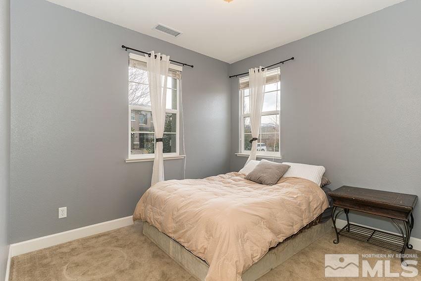 315 Sondrio Way Reno, NV 89521 - Photo 8 of 16 a bedroom with a bed and window