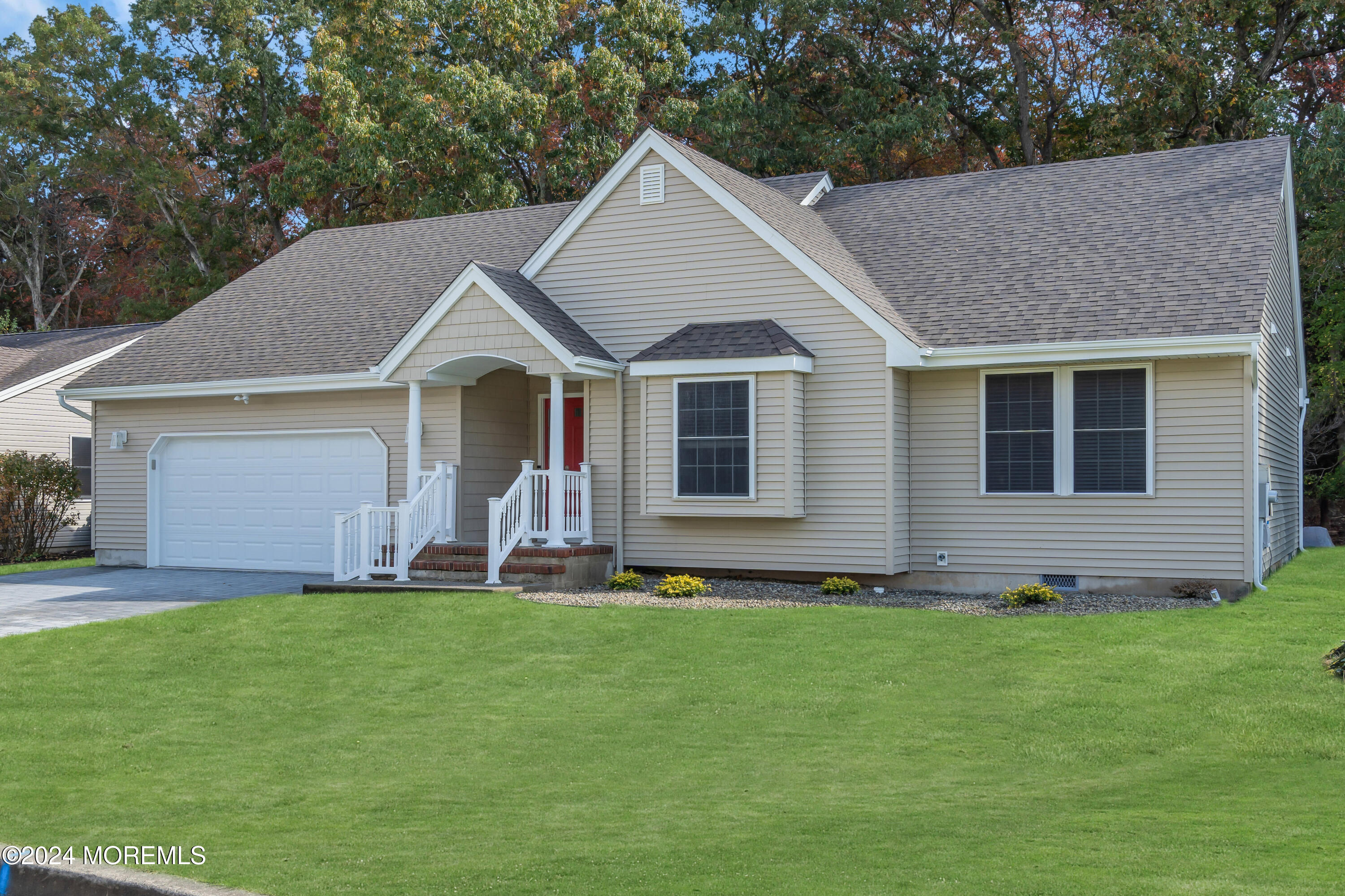 239 Sunset Drive Forked River, NJ 08731 - Photo 1 of 35 a front view of a house with a garden and yard
